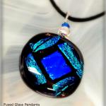 Add a touch of sparkle with this  collection of dichroic fused glass pendants. Locally made by Coastal Glass Works in Plymouth, MA.